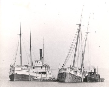 Abercorn - on bottom after hitting obstruction - note lightering schooner barge standing by