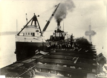 "Manistique", a salvaging tug on the scene, spring or summer 1911 or 1912.