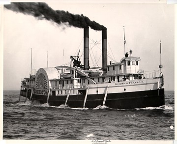 Starboard bow view, notice hull &#034;fenders&#034;, wooden poles hanging down the sides, to protect the hull from scraping against docks.