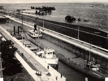 Fully loaded, downbound in the Soo Locks, c.1895-1900.